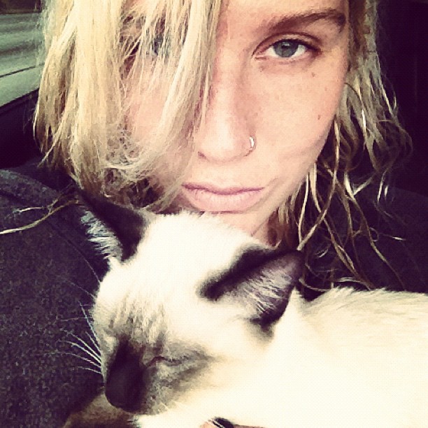 Ke$ha holding her cat Mr. Peep$